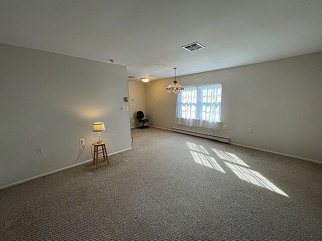 Photo of 120 Exmore Ct Unit D, Ridge, NY