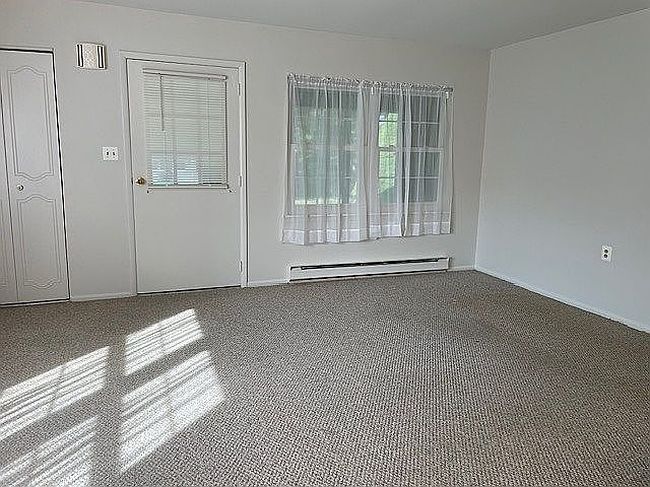 Photo of 120 Exmore Ct Unit D, Ridge, NY