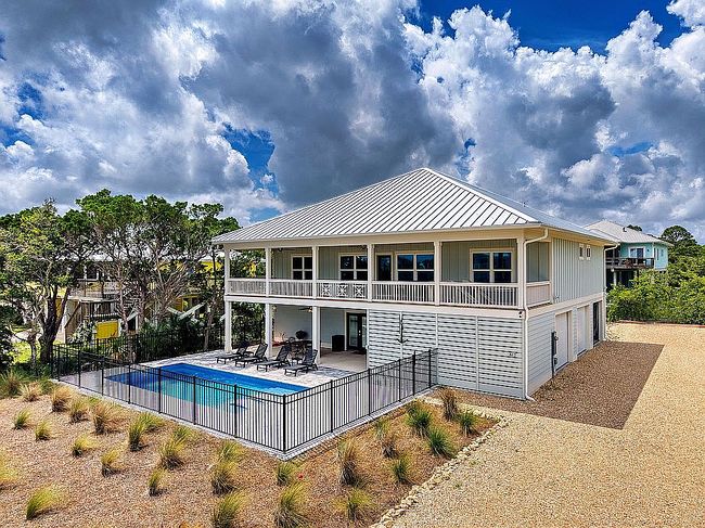 Photo of 617 W Gulf Beach Dr, Eastpoint, FL